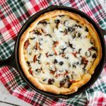 Say no to take out pizza and make you own easy Deep Pan Pizza made in a cast-iron skillet. Layers of meats, cheeses, and a golden crust.
